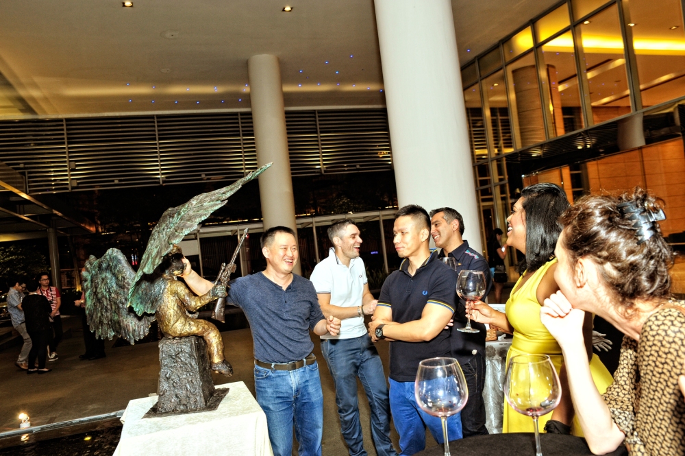Artist Ch'ng Huck Theng (left) explained the story behind his works to the guests